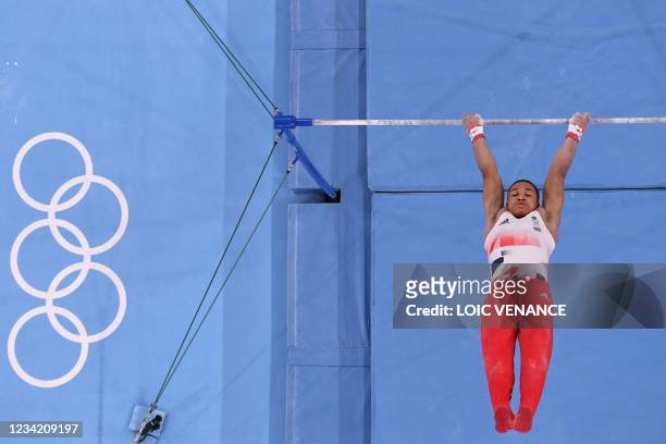 Britain's Joe Fraser competes in the horizontal bars event of the artistic gymnastics men's team final during the Tokyo 2020 Olympic Games at the...
