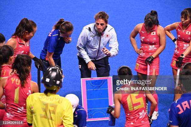 Japan's Spanish head coach Xavier Arnau gives instructions to the players during the women's pool B match of the Tokyo 2020 Olympic Games field...