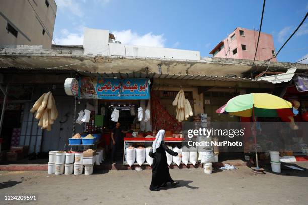Palestinians shop at Al-Zawiya market, in Gaza City, Gaza, July 26, 2021.