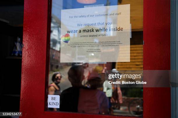 Provincetown A sign at the Heaven Cafe encourages customers to wear masks until seated, in Provincetown, MA on July 24, 2021.