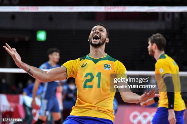 Brazil's Alan Souza celebrates victory in the men's preliminary round pool B volleyball match between Brazil and Argentina during the Tokyo 2020...