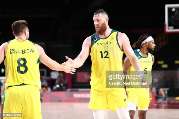 Matthew Dellavedova and Aron Baynes of the Australia Men's National Team high five during the 2020 Tokyo Olympics on July 25, 2021 at Saitama Super...