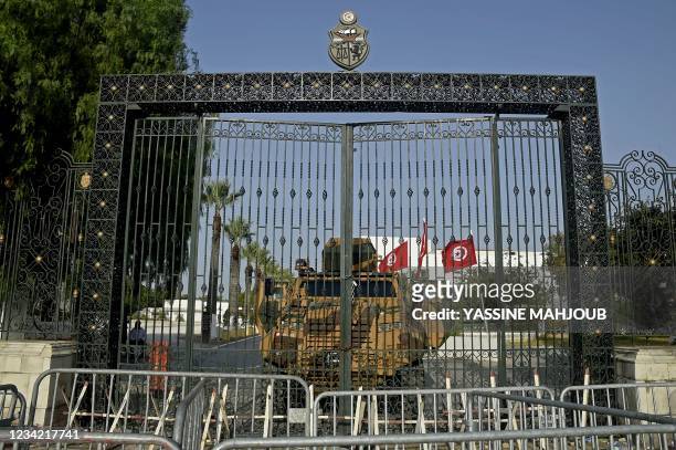 Tunisian army barricade the parliament building in the capital Tunis on July 26 after the president dismissed the prime minister and ordered...