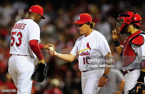 Tony La Russa of the St. Louis Cardinals takes the ball from Arthur Rhodes during a game against the Cincinnati Reds at Busch Stadium on September 2,...