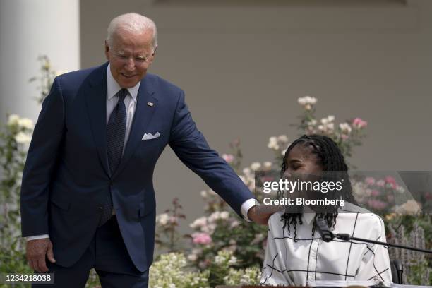 President Joe Biden, left, and Tyree Brown attend an event marking the 31st anniversary of the Americans with Disabilities Act in the Rose Garden of...