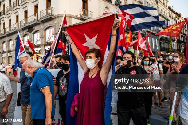 Protesters carrying flags and placards during a demonstration against the US economic embargo on Cuba, coinciding with the 26 of July, the day on...