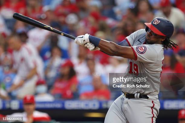 Josh Bell of the Washington Nationals hits an RBI triple in the fourth inning of a game against the Philadelphia Phillies at Citizens Bank Park on...