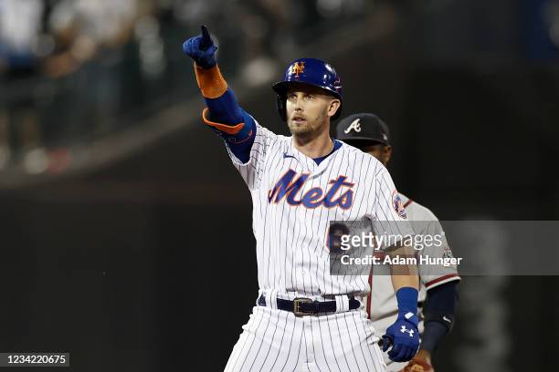 Jeff McNeil of the New York Mets reacts on second base after hitting an RBI double in the fifth inning against the Atlanta Braves during game two of...