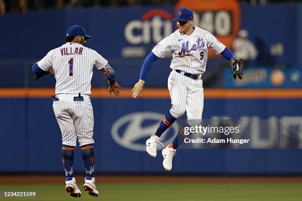 Brandon Nimmo and Jonathan Villar of the New York Mets celebrate after defeating the Atlanta Braves 1-0 during game two of a doubleheader at Citi...
