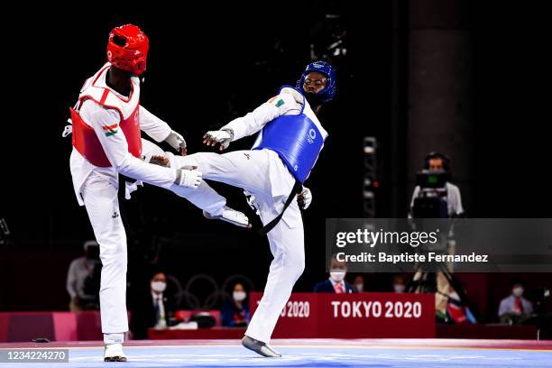 Seydou GBANE of Ivory Coast against Abdoul Razak ISSOUFOU ALFAGA of Niger compete in the Taekwondo Women +67kg during the Tokyo 2020 Olympic Games at...