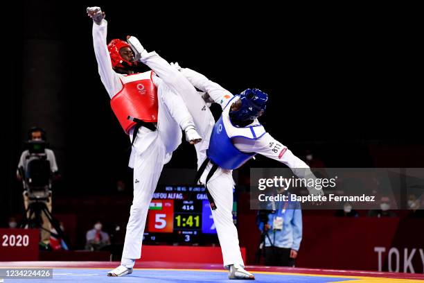 Seydou GBANE of Ivory Coast against Abdoul Razak ISSOUFOU ALFAGA of Niger compete in the Taekwondo Women +67kg during the Tokyo 2020 Olympic Games at...