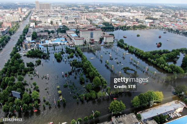 This aeiral photo taken on July 26, 2021 shows a flooded area in Weihui, Xinxiang city, in China's central Henan province. - China OUT / China OUT