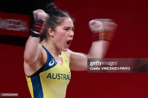 Australia's Kiana Rose Elliott reacts during the women's 64kg weightlifting competition during the Tokyo 2020 Olympic Games at the Tokyo...