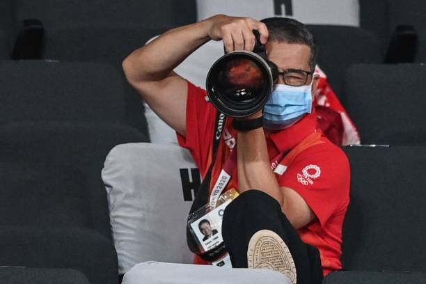 singapores-minister-for-culture-community-and-youth-edwin-tong-takes-photos-as-he-attends-the.jpg
