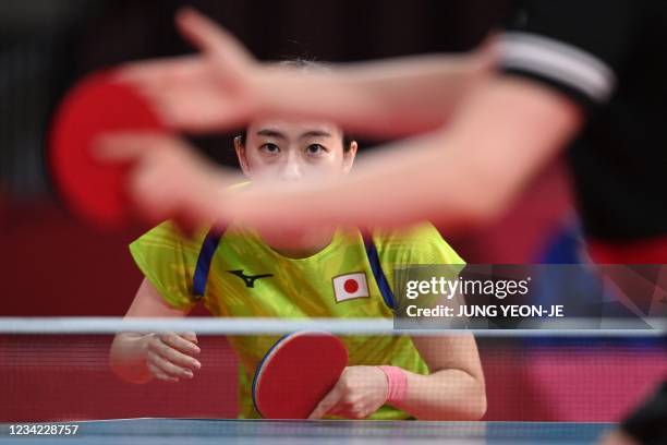 Japan's Kasumi Ishikawa competes against Austria's Sofia Polcanova during her women's singles round of 16 table tennis match at the Tokyo...