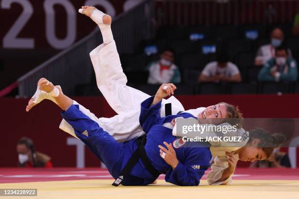 Venezuela's Anriquelis Barrios and Canada's Catherine Beauchemin-Pinard compete in the judo women's -63kg bronze medal B bout during the Tokyo 2020...