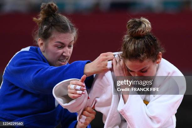 Venezuela's Anriquelis Barrios and Canada's Catherine Beauchemin-Pinard compete in the judo women's -63kg bronze medal B bout during the Tokyo 2020...