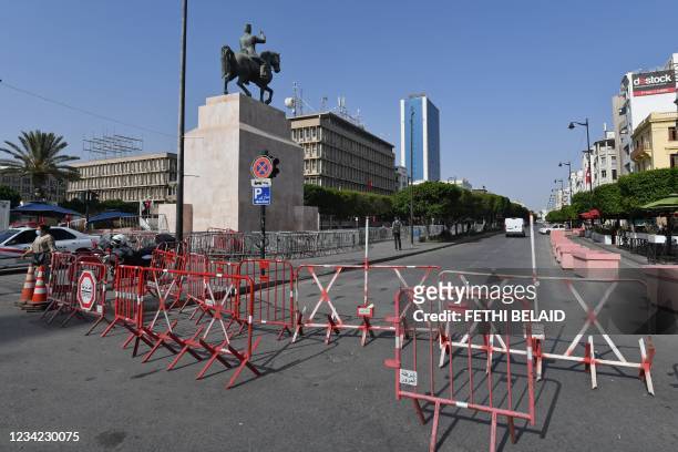Tunisian police barricade the Habib Bourguiba avenue in Tunis on July 27, 2021. - Tunisia, the birthplace of the Arab Spring revolts a decade ago and...