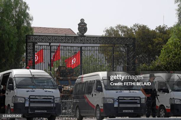 Tunisian police stand guard outside the parliament in Tunis on July 27, 2021. - Tunisia, the birthplace of the Arab Spring revolts a decade ago and...