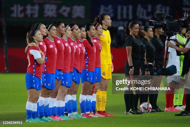 The Chil team line up to sing their national anthem before the Tokyo 2020 Olympic Games women's group E first round football match between Chile and...