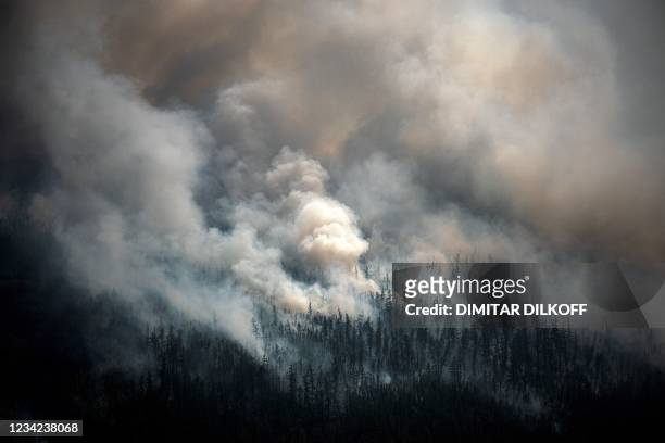 This aerial picture taken from an airplane on July 27 shows the smoke rising from a forest fire outside the village of Berdigestyakh, in the republic...