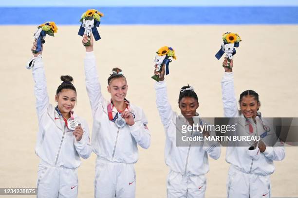 S Sunisa Lee, USA's Grace McCallum, USA's Simone Biles and USA's Jordan Chiles celebrate winning the silver medal during the podium ceremony of the...