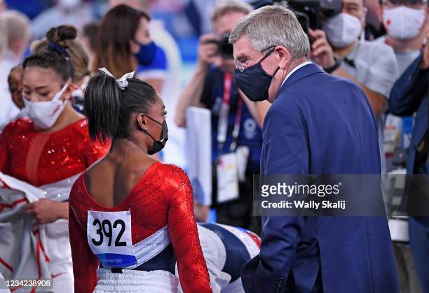 July 26, 2021: USAs Simone Biles talks with IOC President Thomas Bach after the womens team final at the 2020 Tokyo Olympics.