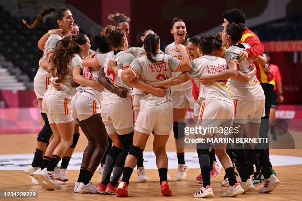 Spain's players celebrate their victory after the women's preliminary round group B handball match between France and Spain of the Tokyo 2020 Olympic...