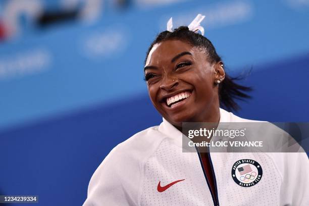 S Simone Biles reacts during the artistic gymnastics women's team final during the Tokyo 2020 Olympic Games at the Ariake Gymnastics Centre in Tokyo...