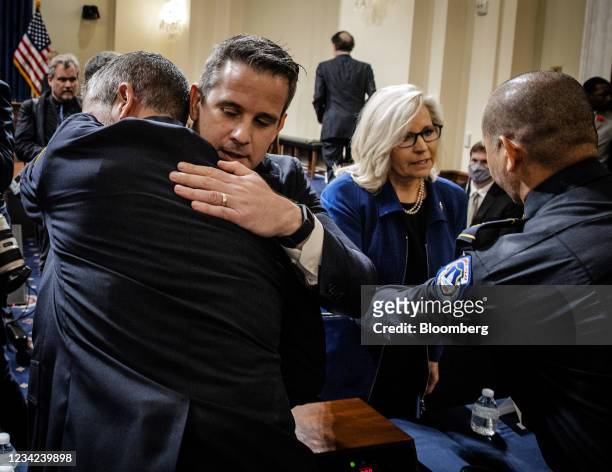 Representative Liz Cheney, a Republican from Wyoming, second right, greets Aquilino Gonell, sergeant with the U.S. Capitol Police, right, as...