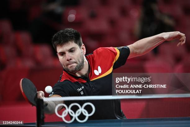 Germany's Dimitrij Ovtcharov competes against Japan's Koki Niwa during his men's singles round of 16 table tennis match at the Tokyo Metropolitan...