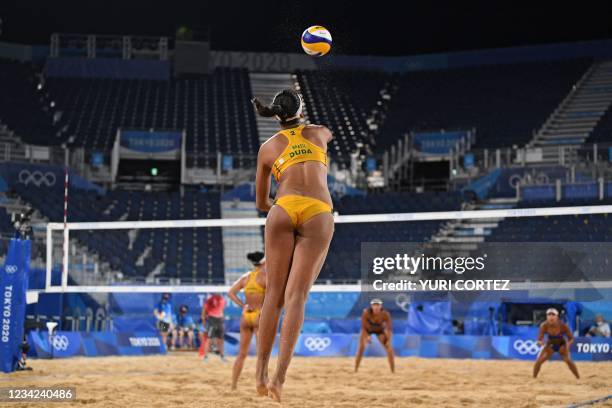 Brazil's Eduarda Santos Lisboa serves the ball during their women's preliminary beach volleyball pool C match between Brazil and China during the...