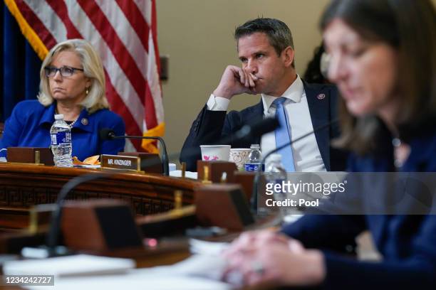 Rep. Liz Cheney and Rep. Adam Kinzinger listen as Rep. Elaine Luria speaks during the House Select Committee investigating the January 6 attack on...