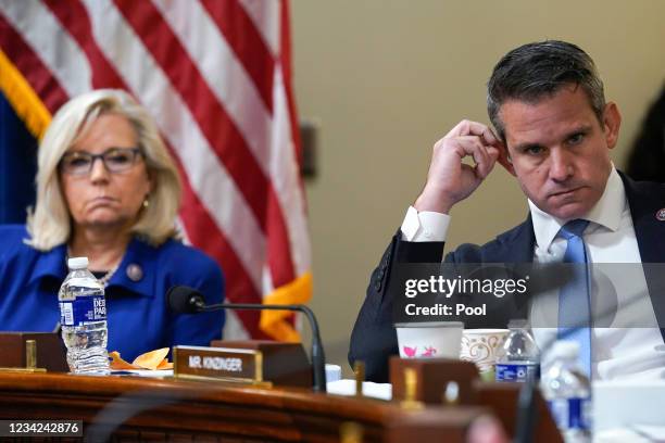 Rep. Liz Cheney and Rep. Adam Kinzinger listen as Rep. Elaine Luria speaks during the House Select Committee investigating the January 6 attack on...