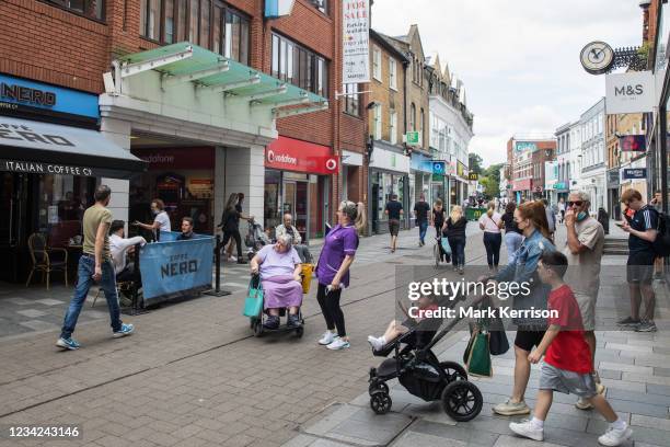 Shoppers come and go between high street shops on 27th July 2021 in Maidenhead, United Kingdom. Many independent high street businesses are believed...