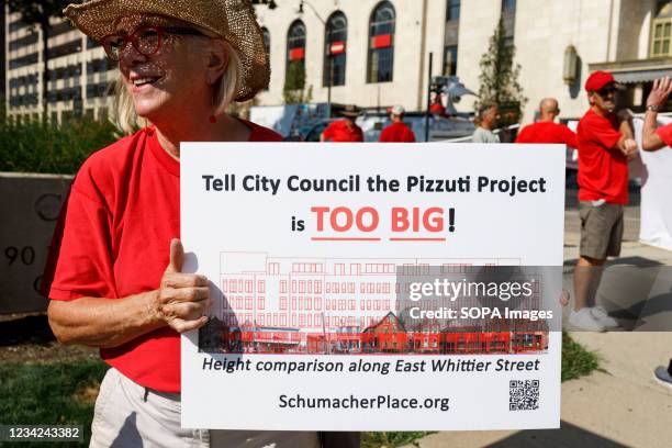 Community member holds a placard to oppose development of their neighborhood by The Pizzuti Companies. Community members of the German Village,...