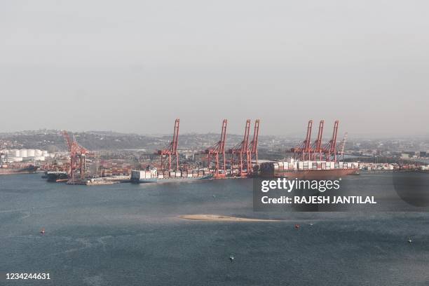 Cargo vessels are seen at the terninals at the Port of Durban harbour, after the State-owned Transport/Logistics company, Transnet was affected by a...