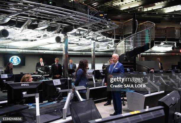 President Joe Biden tours the National Counterterrorism Center Watch Floor at the Office of the Director of National Intelligence in McLean,...