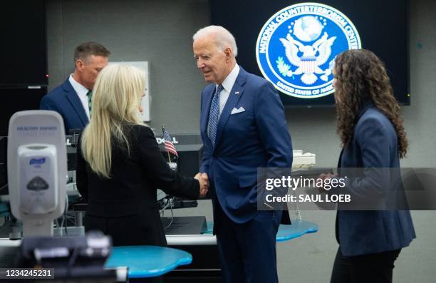 President Joe Biden tours the National Counterterrorism Center Watch Floor at the Office of the Director of National Intelligence in McLean,...