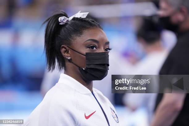 Simone Biles of Team United States looks on during the Women's Team Final on day four of the Tokyo 2020 Olympic Games at Ariake Gymnastics Centre on...