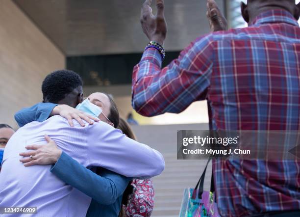 Assistant U.S. Atty. Chelsea Norell hugs surviving victim Dane Brown following Ed Bucks guilty verdict on Tuesday, July 27, 2021 in Los Angeles, CA.