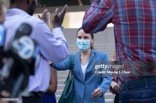 Assistant U.S. Atty. Chelsea Norell is welcomed with applause from friends and family of the victims following Ed Buck guilty verdicts on Tuesday,...