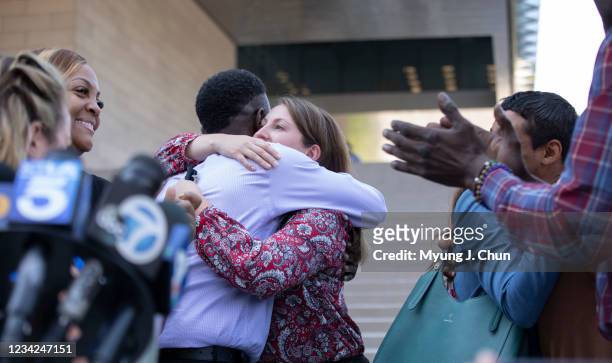 Assistant U.S. Atty. Lindsay Bailey hugs surviving victim Dane Brown following Ed Bucks guilty verdict on Tuesday, July 27, 2021 in Los Angeles, CA.