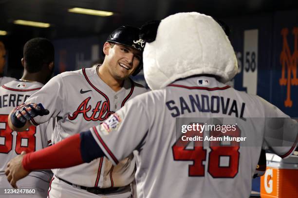 Austin Riley of the Atlanta Braves hugs Pablo Sandoval of the Atlanta Braves after hitting a 2-run home run during the sixth inning against the New...