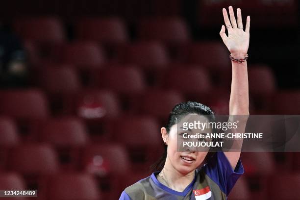 Singapore's Yu MengYu celebrates after defeating Japan's Kasumi Ishikawa during their women's singles quarterfinals table tennis match at the Tokyo...