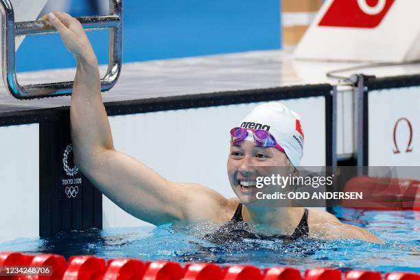 Hong Kong's Siobhan Bernadette Haughey reacts after coming in second in the final of the women's 200m freestyle swimming event during the Tokyo 2020...