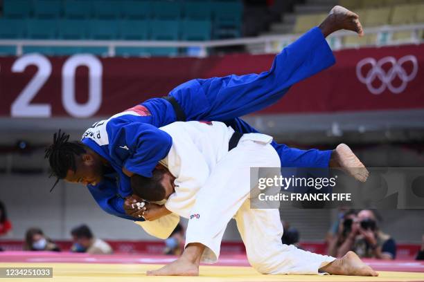 Hungary's Krisztian Toth and Refugee Olympic Team's Popole Misenga compete in the judo men's -90kg elimination round bout during the Tokyo 2020...