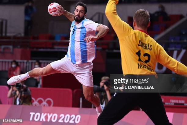 Argentina's left wing Ignacio Pizarro jumps to shoot during the men's preliminary round group A handball match between Norway and Argentina of the...