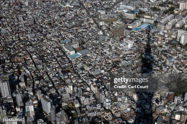 Shadow is cast over the city skyline from the Tokyo Skytree on July 28, 2021 in Tokyo, Japan. Tokyo metropolitan government reported 3,177 new...