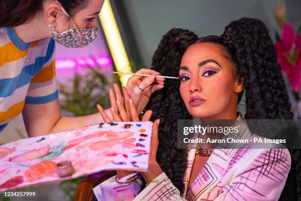 Staff member put the finishing touches to the wax figure of Leigh-Anne Pinnock as Little Mix are unveiled at Madame Tussauds London. Picture date:...